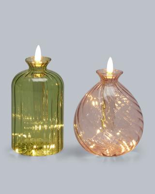 2 LED-Kerzen in Glasflasche