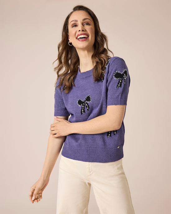 Produktabbildung für Pullover mit Schleifen und Steinchen