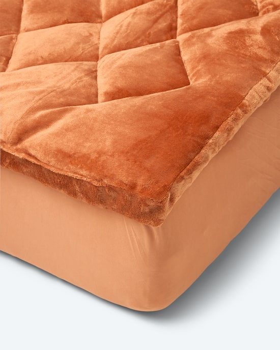 Produktabbildung für Komfort-Auflage "Cozy" in Lammfell-Optik