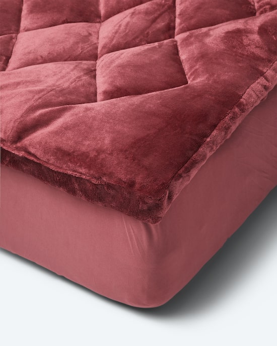 Produktabbildung für Komfort-Auflage "Cozy" in Lammfell-Optik