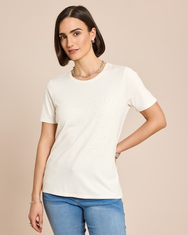 Produktabbildung für Shirt mit Blumen-Applikation