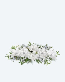 Produktabbildung für Magnoliengesteck mit Kerzenhalter